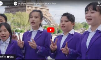 Children from Wuzhishan, Hainan Sings on the Seine in Paris during the opening performance of the Sino-French Gourmet Carnival